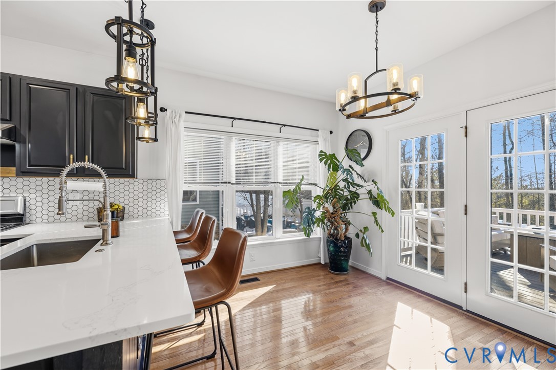 940 Gorham Court Midlothian, VA 23114 - Photo 10 of 45 a view of a dining room with furniture window and wooden floor