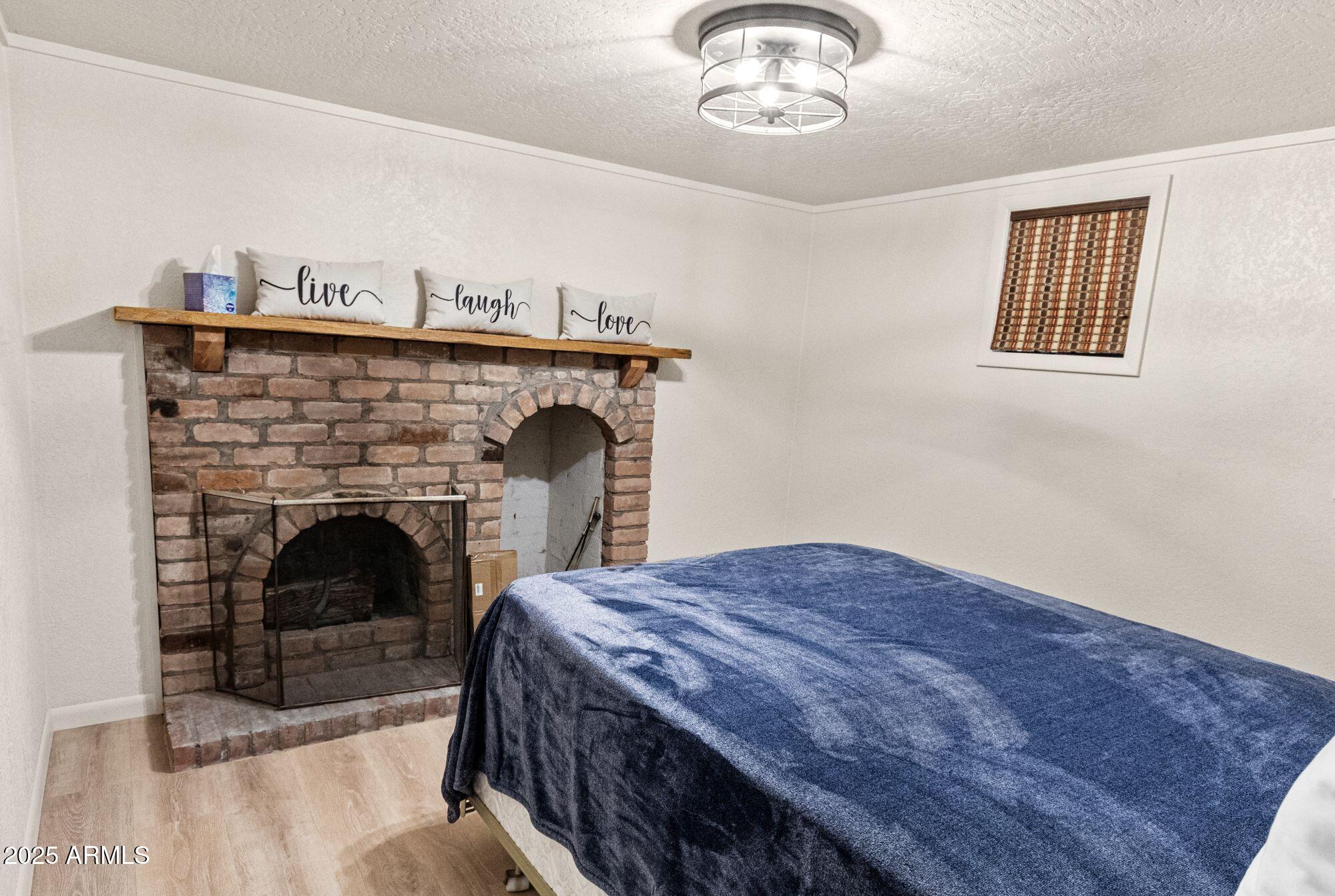 341 Pinto Road Forest Lakes, AZ 85931 - Photo 23 of 30 a living room with a fireplace and a chandelier
