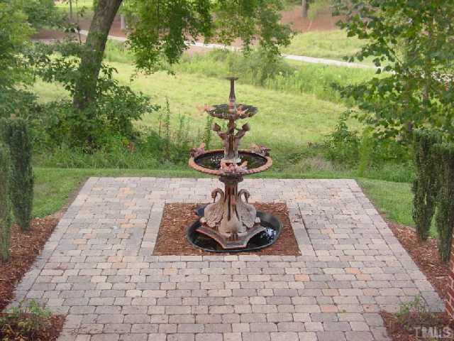 2701 Peachleaf Street Raleigh, NC 27614 - Photo 10 of 10 YOU'LL ENJOY LOOKING OUT AT THE FOUNTAIN IN THE BACK YARD. Back Yard