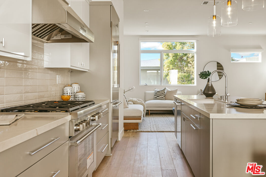 3220 South Barrington Avenue Los Angeles, CA 90066 - Photo 1 of 30 a kitchen with stainless steel appliances a sink stove and cabinets