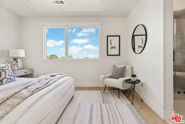 a bed room with a bed and a window