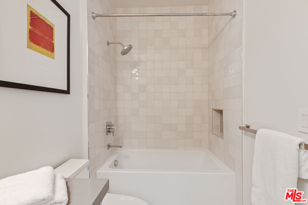 3220 South Barrington Avenue Los Angeles, CA 90066 - Photo 26 of 30 a bathroom with a bathtub and a shower
