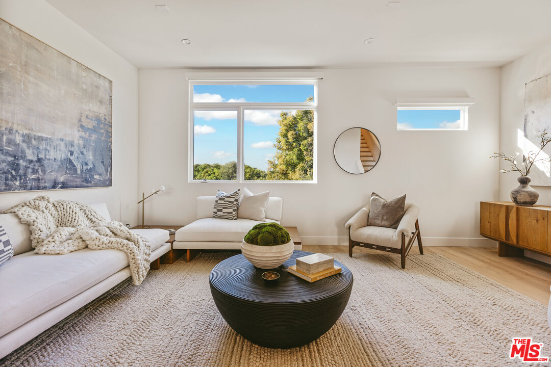 3220 South Barrington Avenue Los Angeles, CA 90066 - Photo 5 of 30 a living room with furniture and a large window