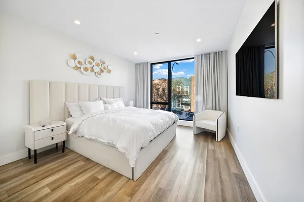 a view of walk in closet and storage