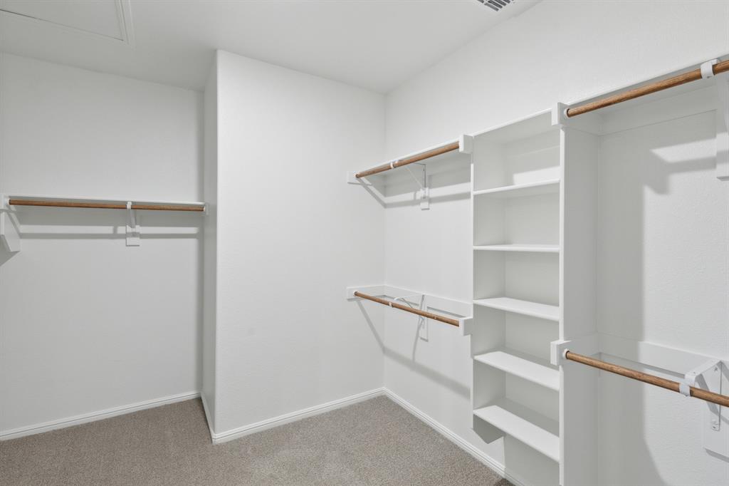 1161 Del Rio Drive Lavon, TX 75166 - Photo 22 of 38 Primary Closet in the Holden home plan by Trophy Signature Homes – REPRESENTATIVE PHOTO