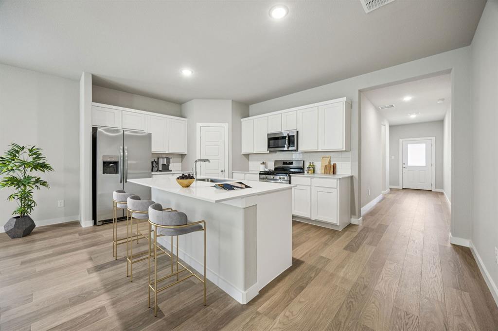 1161 Del Rio Drive Lavon, TX 75166 - Photo 5 of 38 Kitchen in the Holden home plan by Trophy Signature Homes – REPRESENTATIVE PHOTO