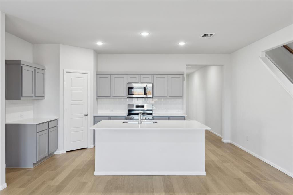 1161 Del Rio Drive Lavon, TX 75166 - Photo 8 of 38 Kitchen in the Holden home plan by Trophy Signature Homes – REPRESENTATIVE PHOTO