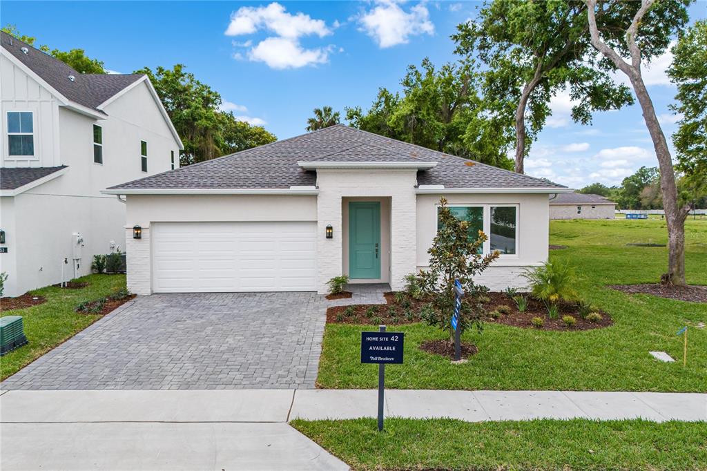 55 Overleaf Lane Orlando, FL 32839 - Photo 1 of 1 a front view of house with yard and green space