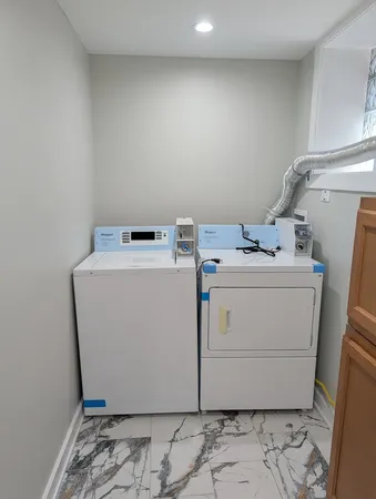 a utility room with dryer and washer