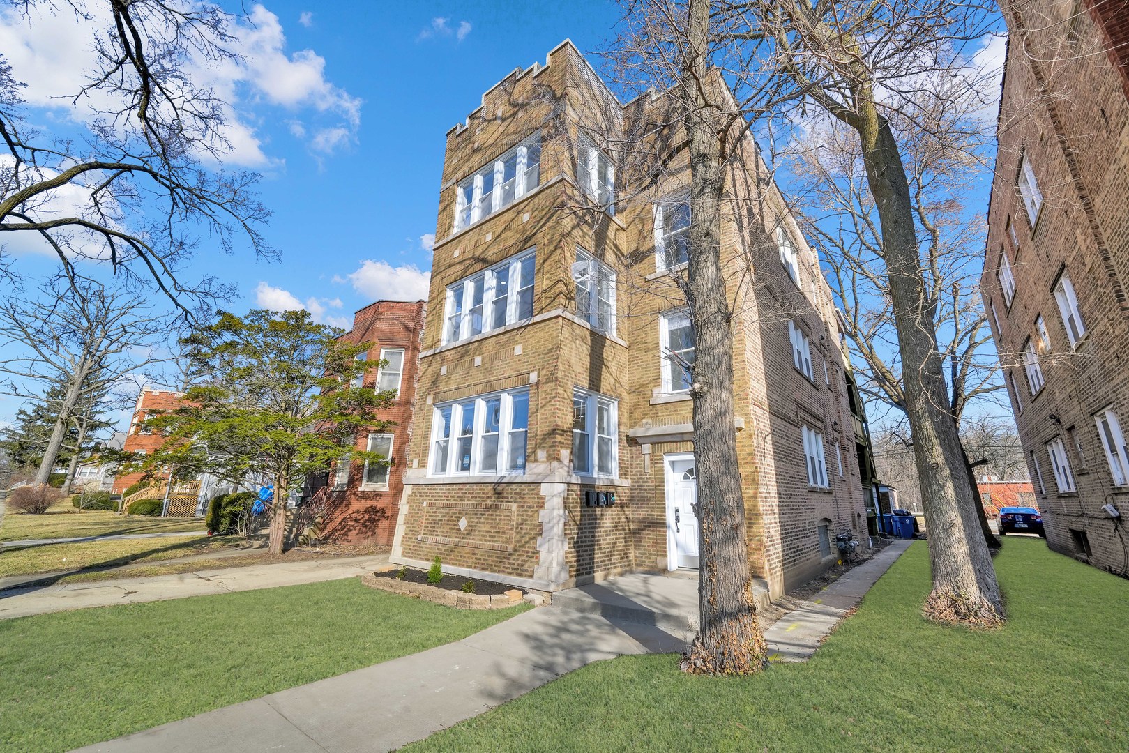 41 West 14th Place, Unit B Chicago Heights, IL 60411 - Photo 2 of 16 front view of a residential houses with yard and trees
