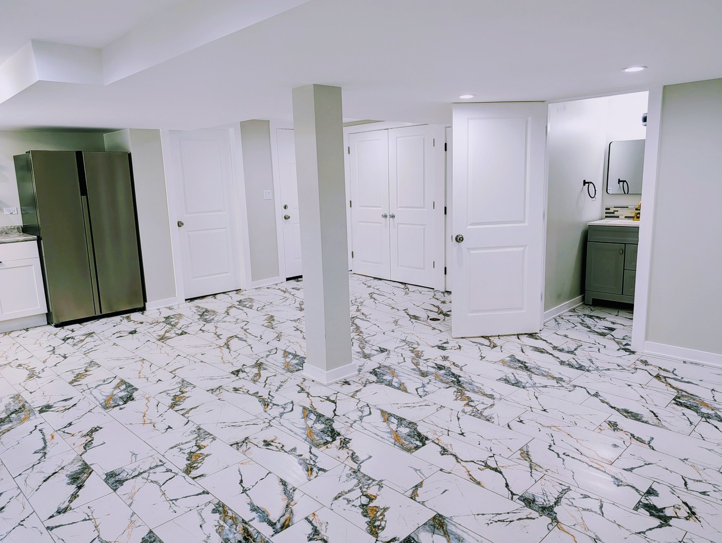 41 West 14th Place, Unit B Chicago Heights, IL 60411 - Photo 6 of 16 a view of a hallway with cabinet and a refrigerator