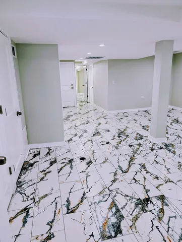 a large bedroom with a bed