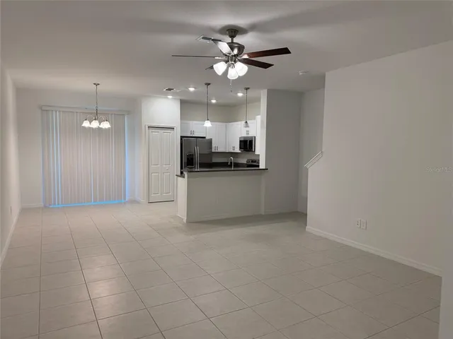 a view of a kitchen with a sink and a stove top oven