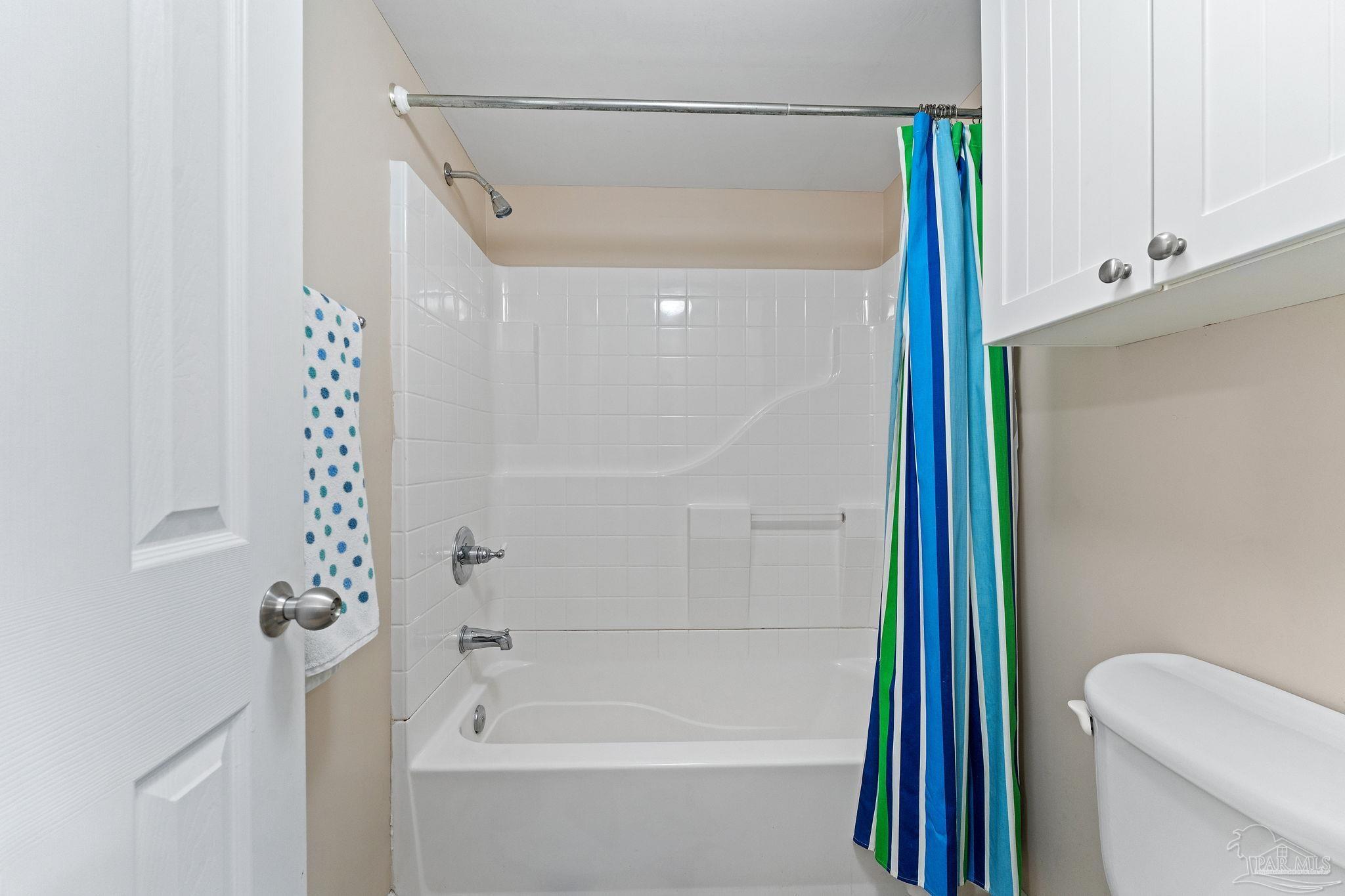 14623 Perdido Key Drive, Unit W106 Perdido Key, FL 32507 - Photo 16 of 50 a bathroom with a shower a toilet and a bathtub