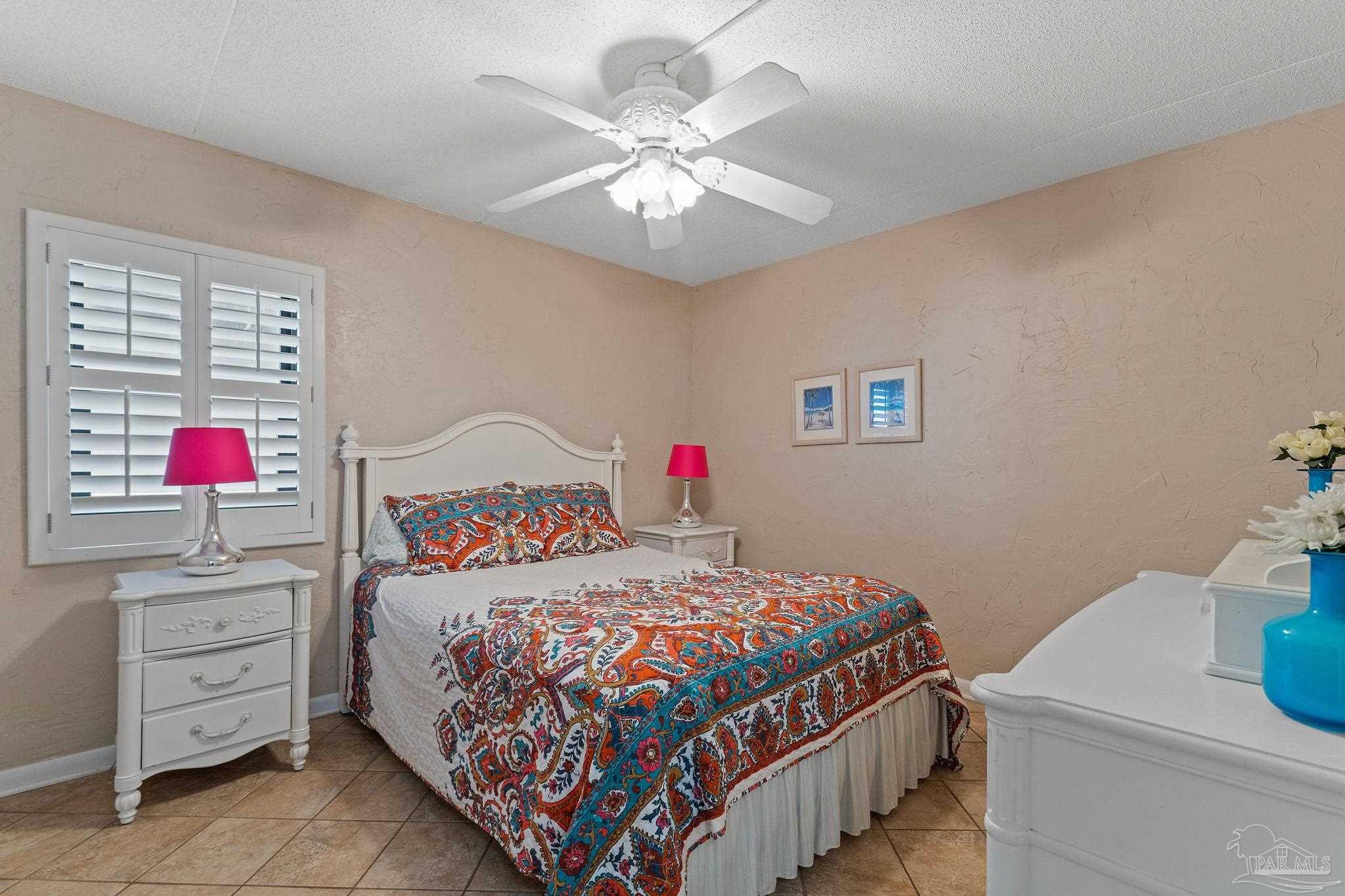 14623 Perdido Key Drive, Unit W106 Perdido Key, FL 32507 - Photo 18 of 50 a bedroom with a bed and a dresser