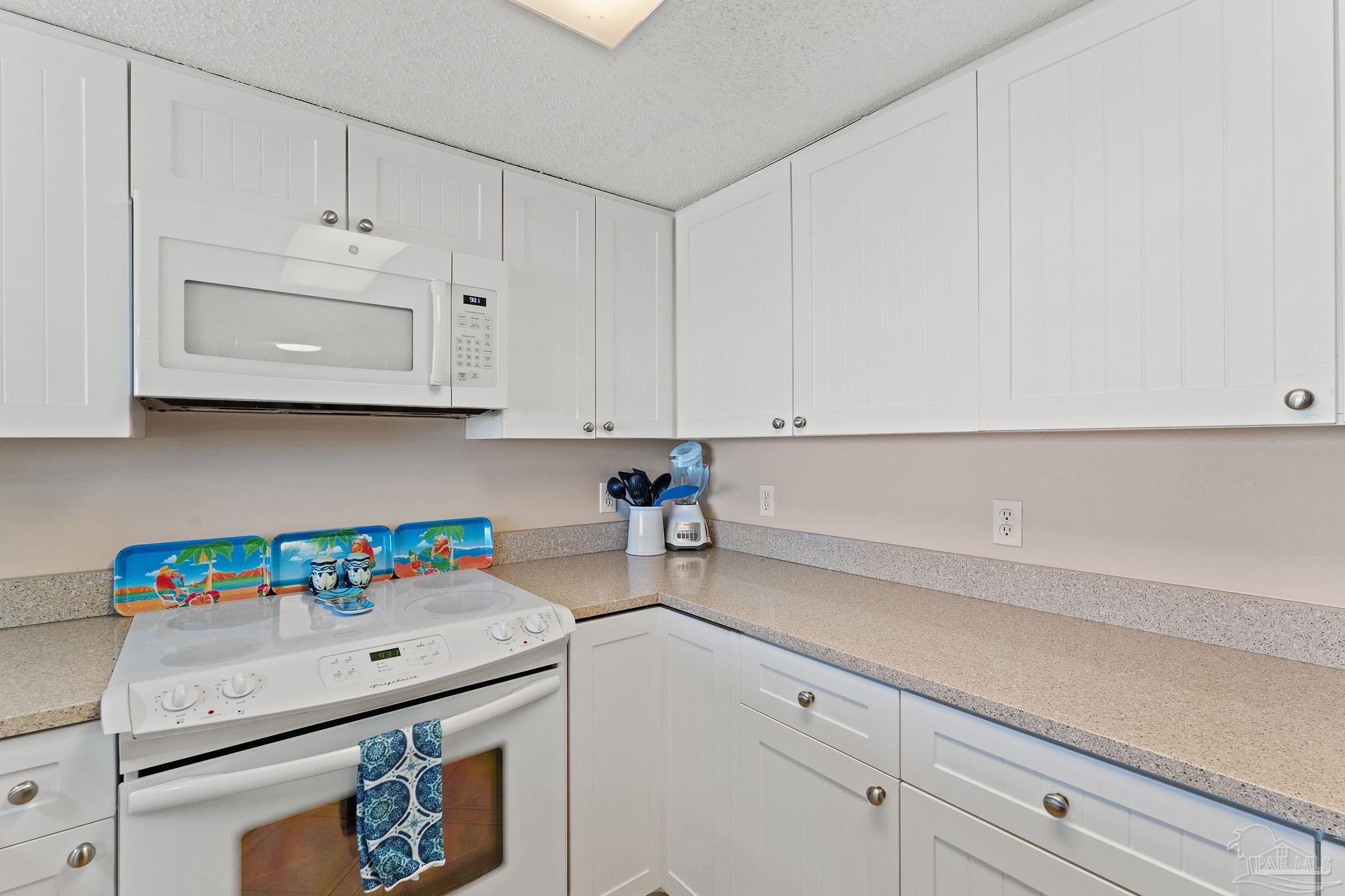 14623 Perdido Key Drive, Unit W106 Perdido Key, FL 32507 - Photo 28 of 50 a kitchen with stainless steel appliances white cabinets and a sink