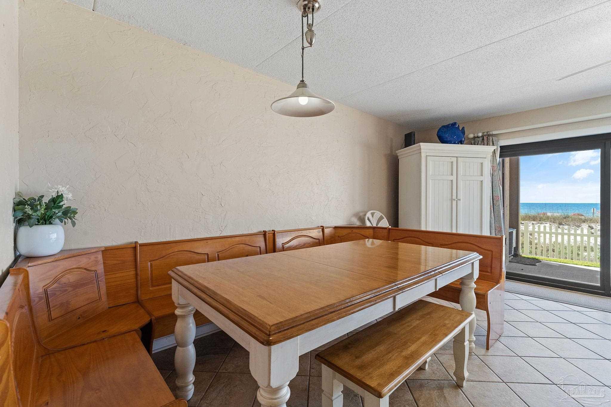 14623 Perdido Key Drive, Unit W106 Perdido Key, FL 32507 - Photo 32 of 50 a living room with a couch and potted plant