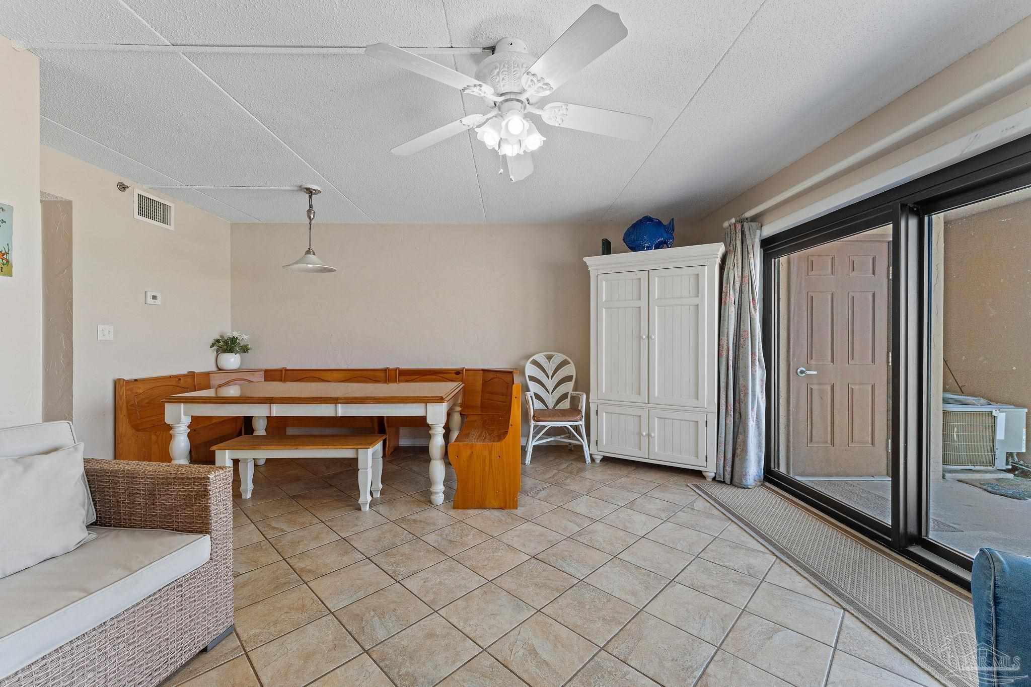 14623 Perdido Key Drive, Unit W106 Perdido Key, FL 32507 - Photo 33 of 50 a living room with furniture and a fireplace