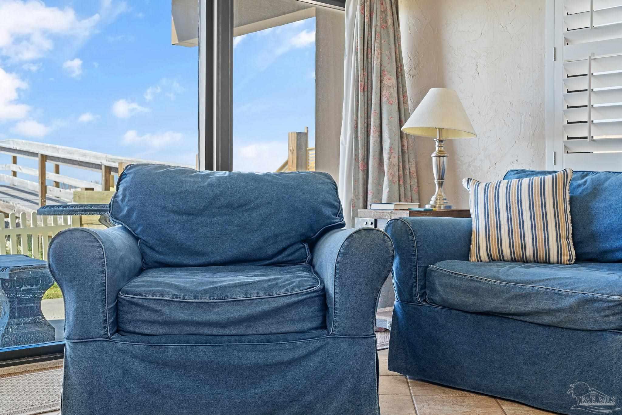 14623 Perdido Key Drive, Unit W106 Perdido Key, FL 32507 - Photo 34 of 50 a living room with furniture and a lamp