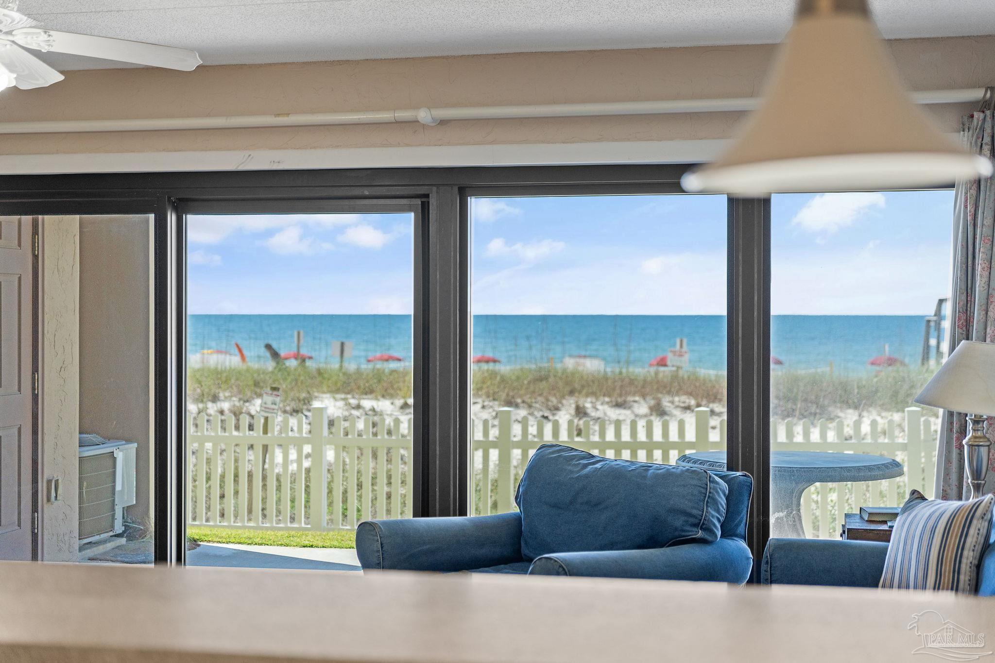 14623 Perdido Key Drive, Unit W106 Perdido Key, FL 32507 - Photo 36 of 50 a living room with furniture and floor to ceiling windows