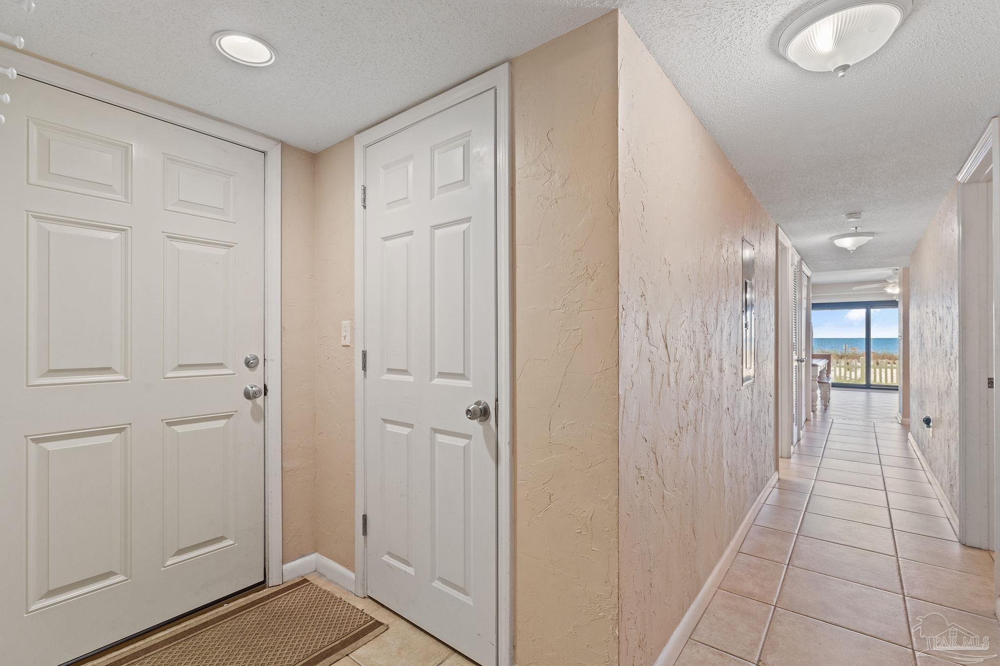 14623 Perdido Key Drive, Unit W106 Perdido Key, FL 32507 - Photo 10 of 50 a view of a hallway with wooden floor