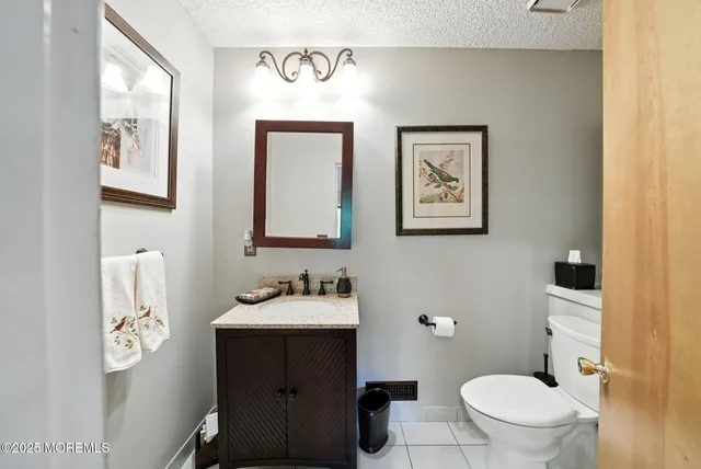 a bedroom with bed and a chandelier