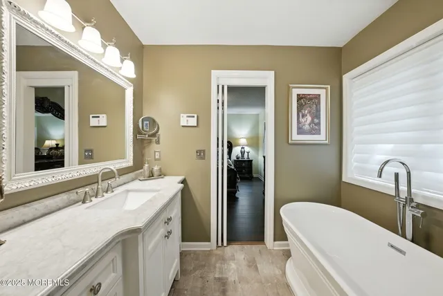 a view of a hallway with paintings on the wall