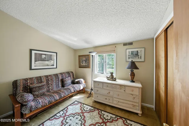 a room with a window and gym equipment