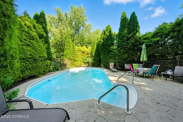 a view of a big yard with large trees