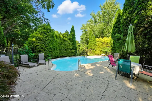 a view of a grassy field with trees