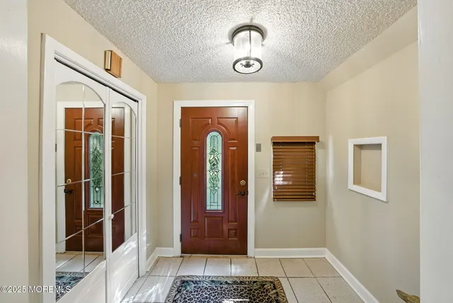 a view of a hallway with wooden door