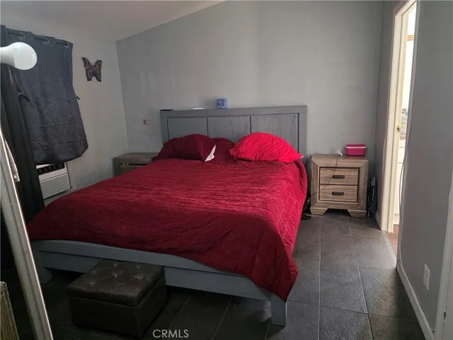 a bedroom with a bed and a closet