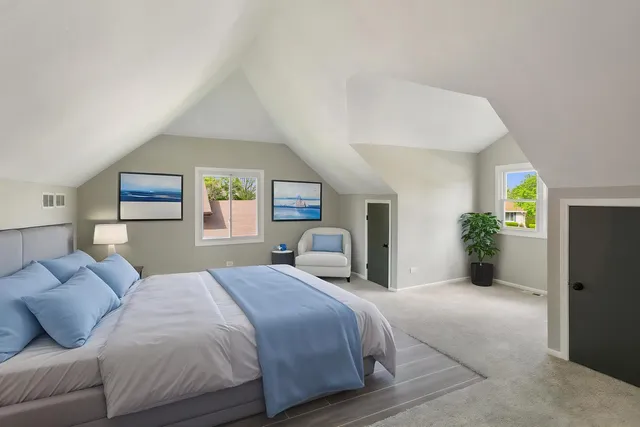 a bedroom with a balcony a bed and a couch