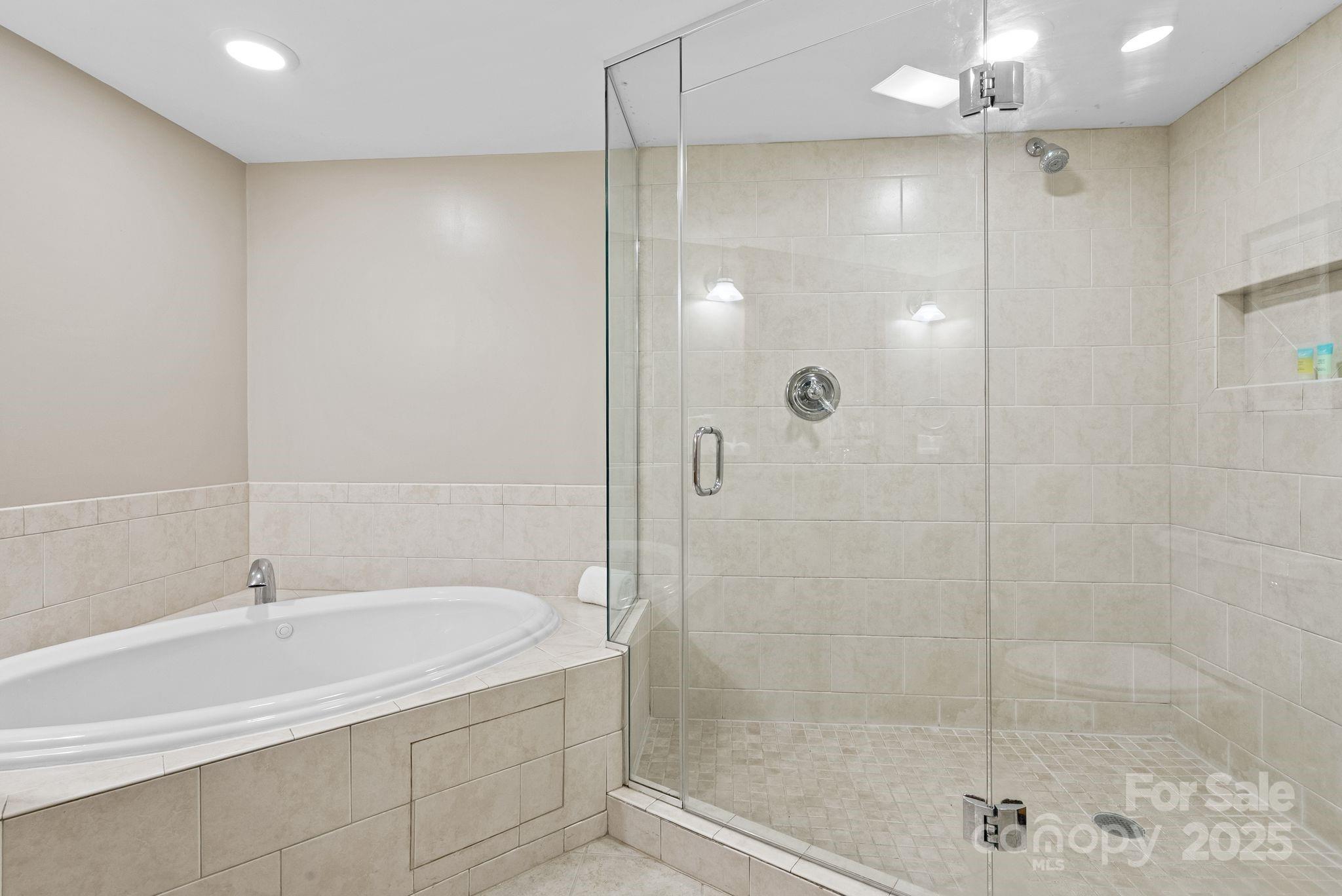 430 Bowling Park Road Asheville, NC 28803 - Photo 14 of 22 a bathroom with a shower and a bathtub