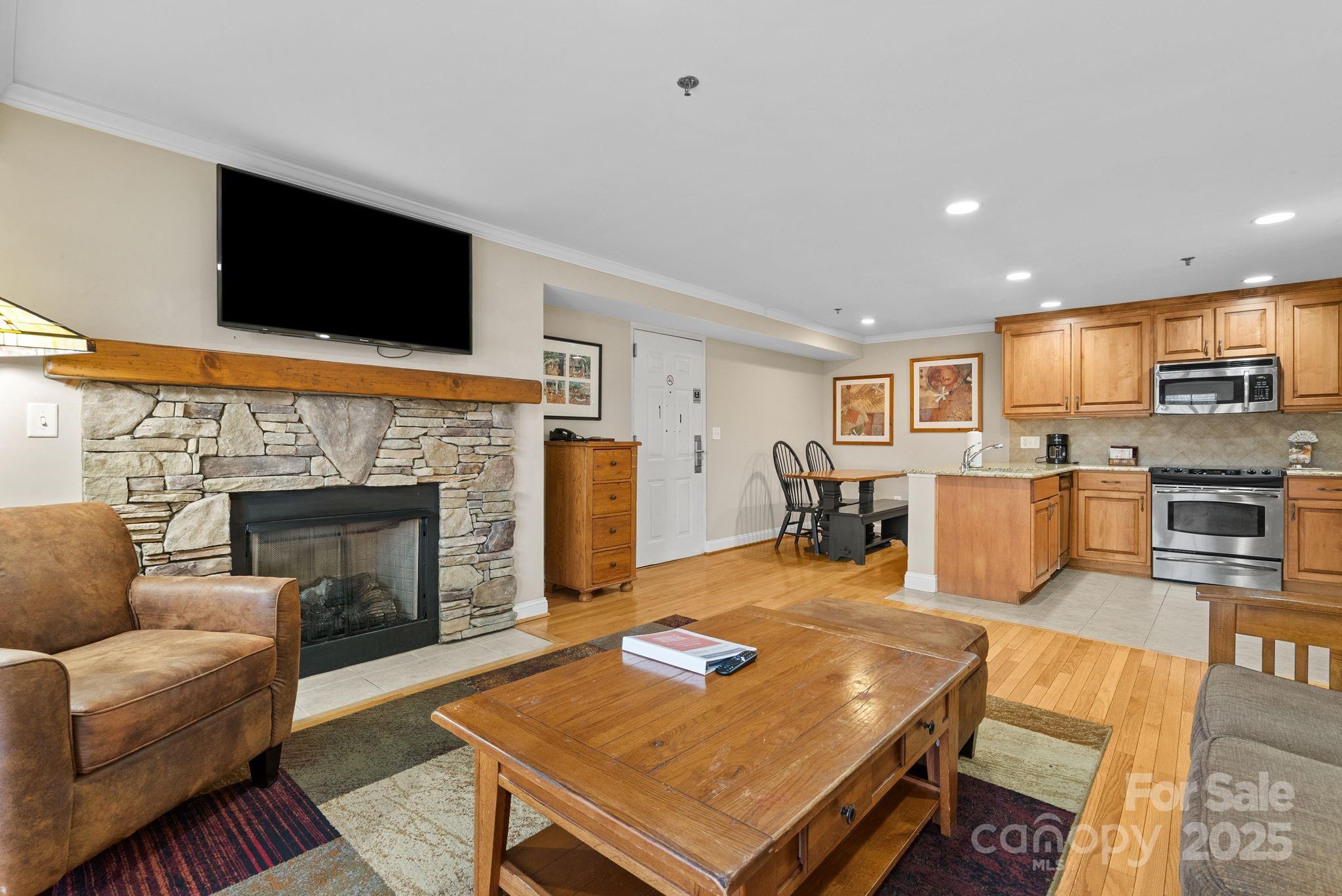 430 Bowling Park Road Asheville, NC 28803 - Photo 5 of 22 a living room with furniture fireplace and flat screen tv