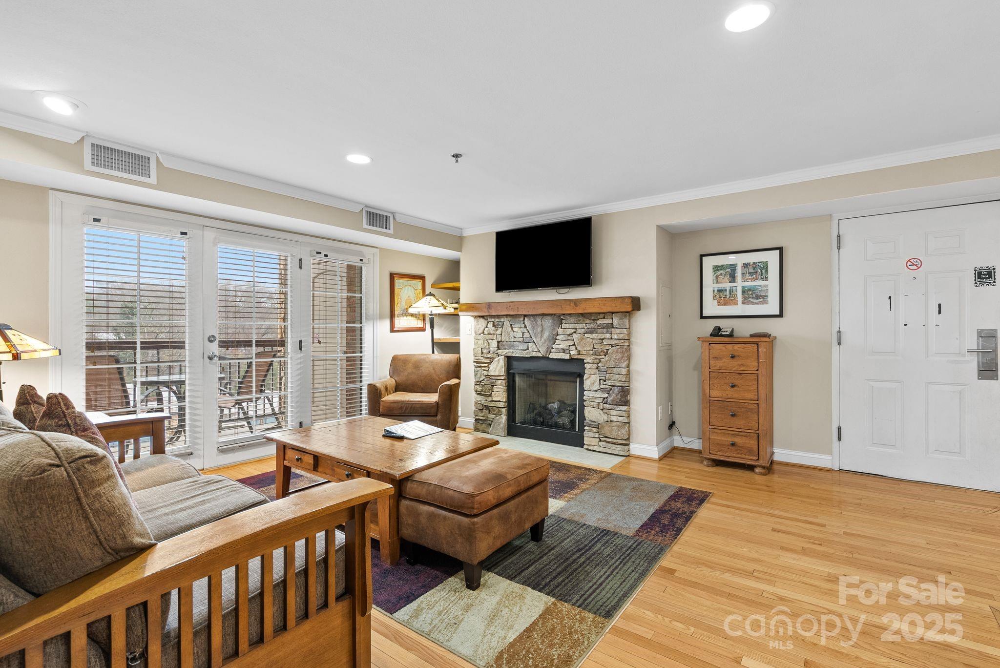 430 Bowling Park Road Asheville, NC 28803 - Photo 6 of 22 a living room with furniture and a fireplace