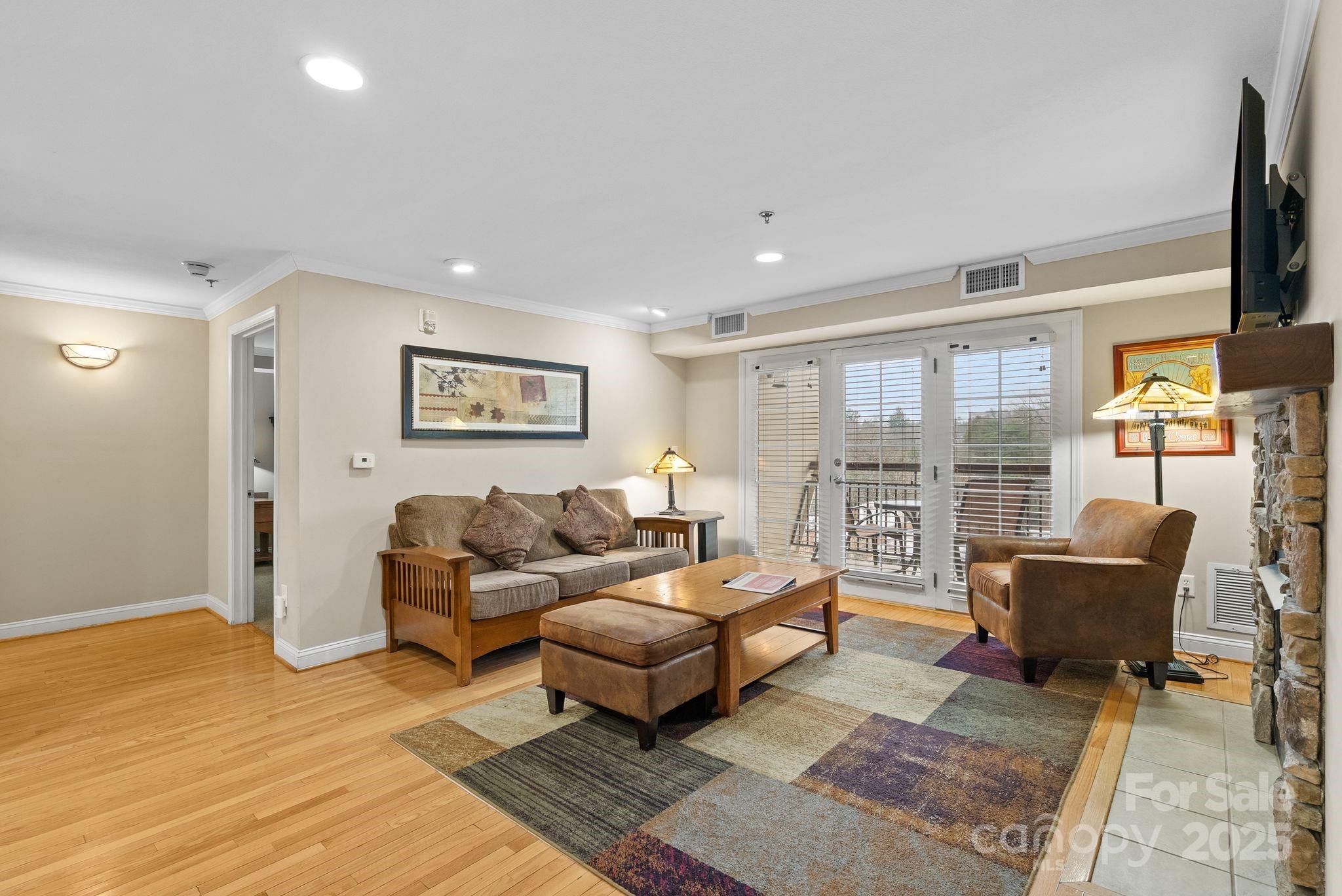 430 Bowling Park Road Asheville, NC 28803 - Photo 7 of 22 a living room with furniture and a floor to ceiling window
