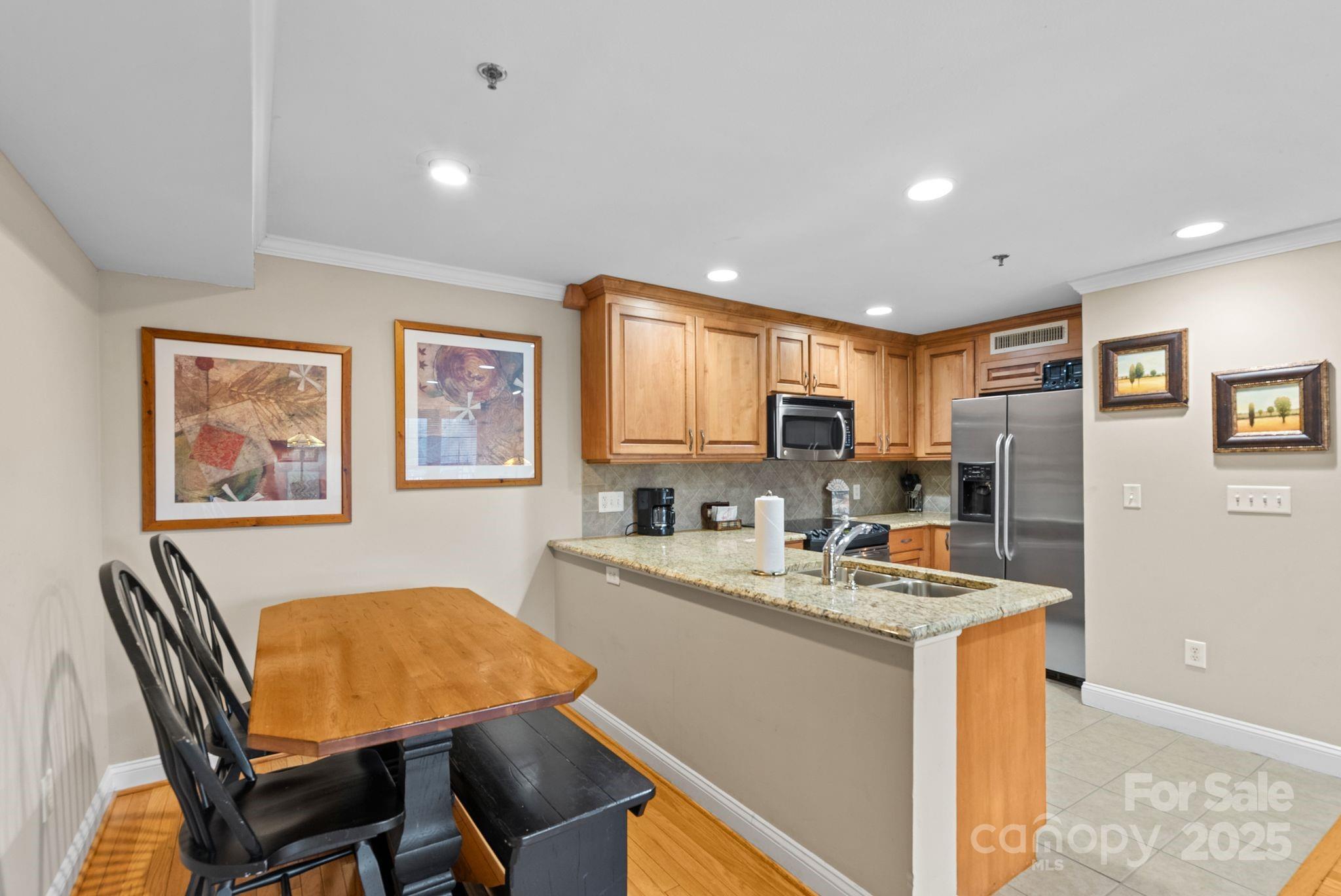 430 Bowling Park Road Asheville, NC 28803 - Photo 9 of 22 a living room with stainless steel appliances furniture a dining table and kitchen view
