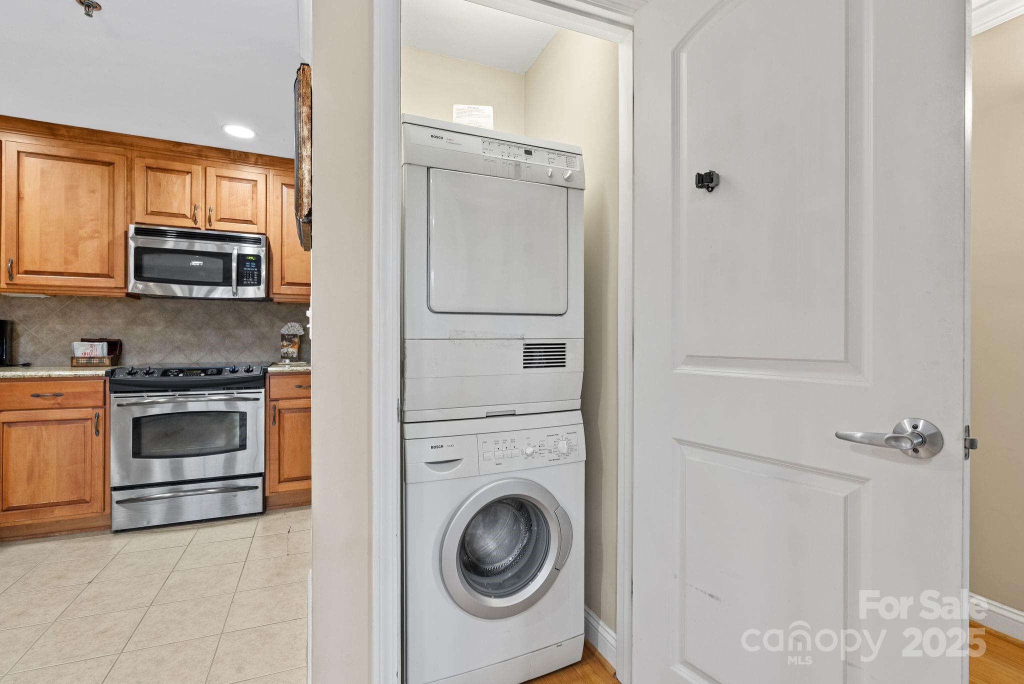 430 Bowling Park Road Asheville, NC 28803 - Photo 10 of 22 a kitchen with a refrigerator and a stove top oven