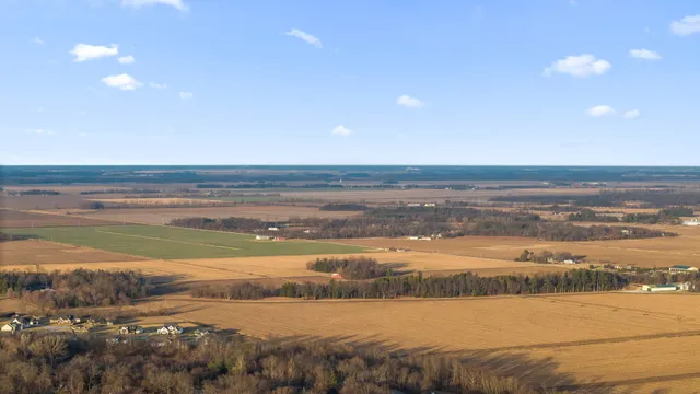 a front view of a building with a yard