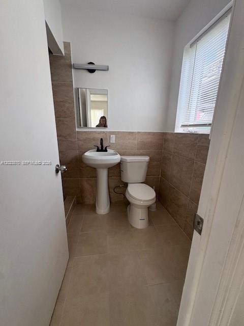 2052 Southwest 7th Street, Unit 4 Miami, FL 33135 - Photo 6 of 10 a bathroom with a sink a toilet and mirror