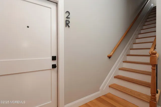 a view of staircase with white walls