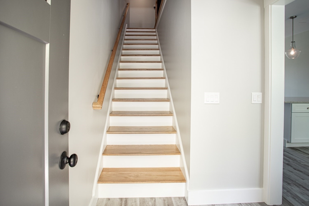 337 Danforth Street, Unit 7 Fall River, MA 02720 - Photo 15 of 28 a view of a hallway with wooden floor and entryway