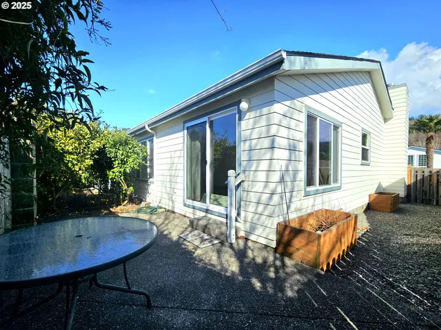 a view of house with yard and entertaining space