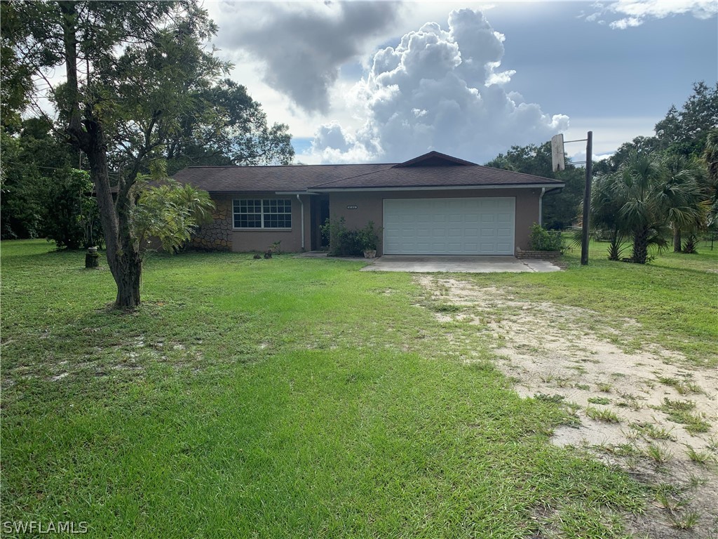 a view of a house with a yard