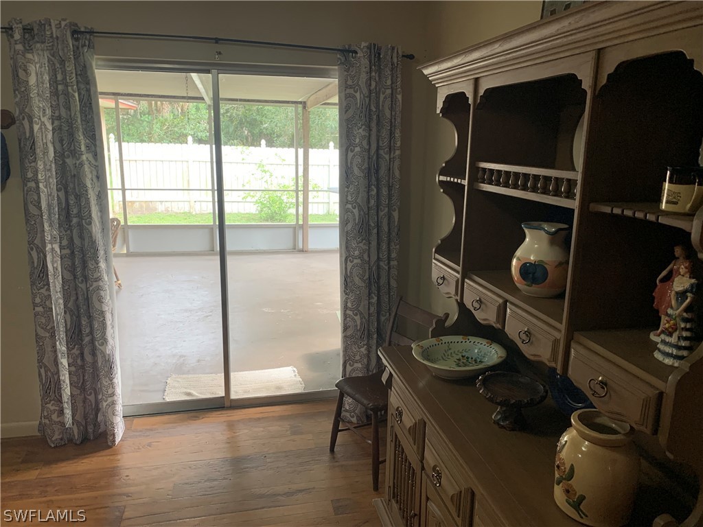 4180 Ellis Road Fort Myers, FL 33905 - Photo 13 of 26 a view of entryway with wooden floor