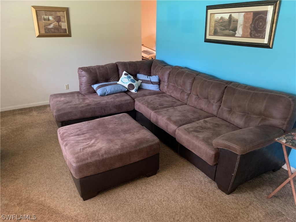 4180 Ellis Road Fort Myers, FL 33905 - Photo 2 of 26 a living room with couches and painting on the wall
