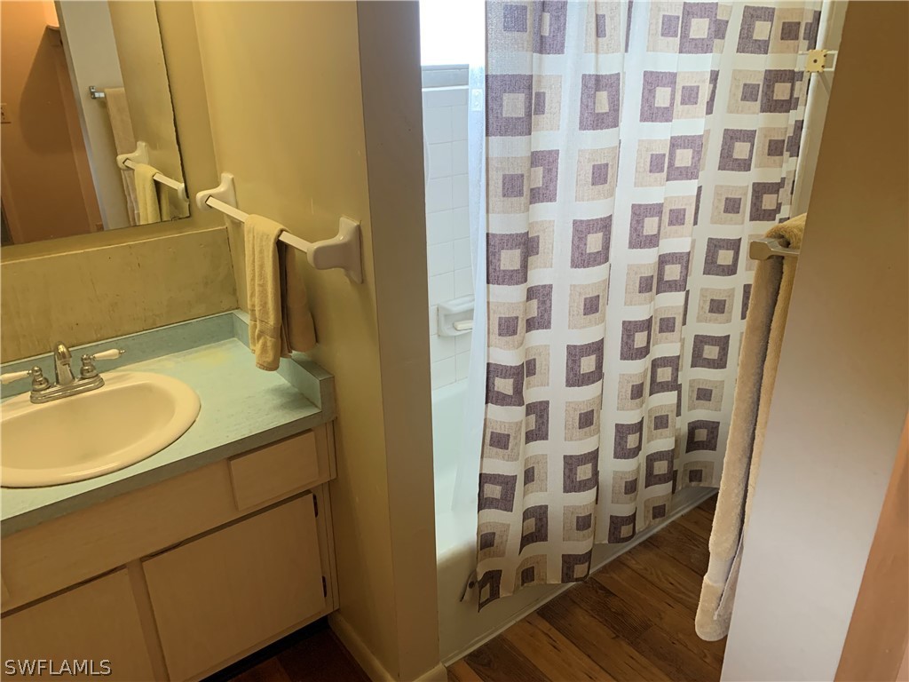 4180 Ellis Road Fort Myers, FL 33905 - Photo 9 of 26 a bathroom with a sink toilet and shower