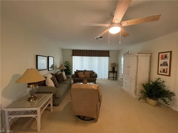 a view of a living room and dining room