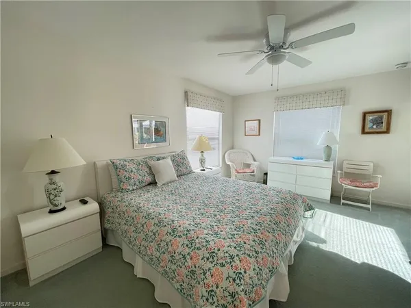 a living room with a bed and furniture